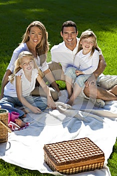 Happy Family Having Picnic In A Park