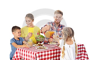 Happy family having picnic at table on white