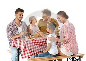 Happy family having picnic at table on white