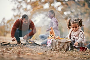 Happy family having a picnic together in the forest