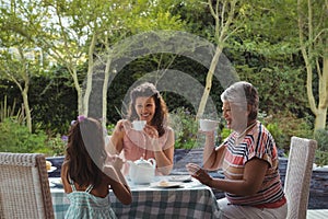 Happy family having tea