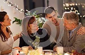 Happy family having tea party at home