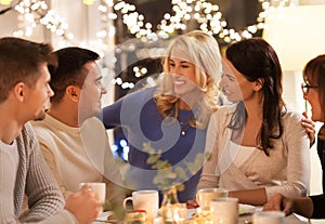 Happy family having tea party at home