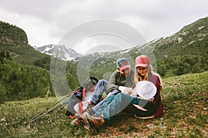 Happy family hiking with baby in mountains travel vacation outdoor