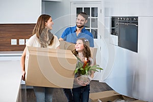 Happy family holding boxes