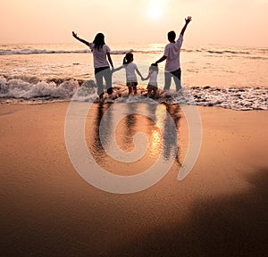 Happy family holding hands