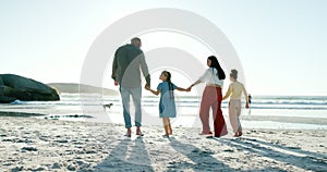 Happy family, holding hands and walking together on beach, sunset and love with bonding on summer holiday. Father