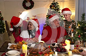 A happy family holds a Christmas party at home