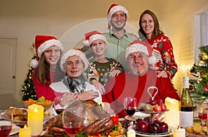 A happy family holds a Christmas party at home on the holiday