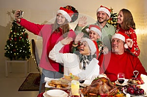 A happy family holds a Christmas party at home on the holiday