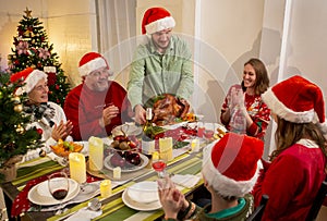 A happy family holds a Christmas party at home on the holiday