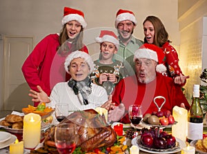 A happy family holds a Christmas party at home on the holiday