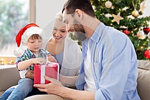 happy family at home with christmas gift box