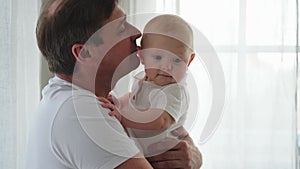 Happy family at home. Father holding little toddler child daughter. Dad baby girl relax playing having fun together at