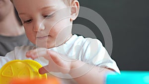 happy family at home. mom and son play toy. happy family together kid dream concept. baby son play collects toy pyramids