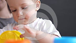 happy family at home. mom and son play toy. happy family together kid dream concept. baby son play fun collects toy