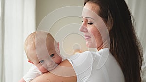 Happy family at home. Mother holding little toddler child daughter. Mom and baby girl relax playing having fun together