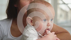 Happy family at home. Mother with little toddler child daughter. Mom and newborn baby girl relax playing having fun