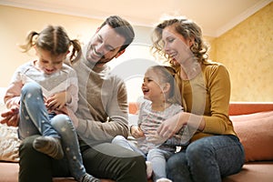 Happy family at home spending time together and playing. Family