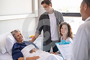 Happy family at hospital with doctor