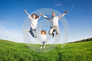 Happy family jumping