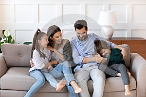Happy family with kids have fun in new home
