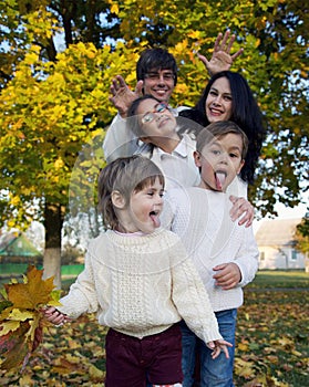 Happy family with kids in park