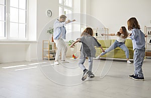 Happy family with kids play football at home