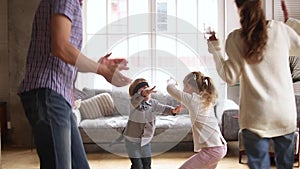 Happy family kids playing hide and clap game at home