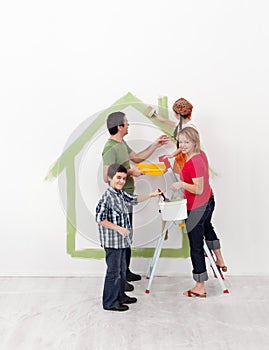 Happy family with kids redecorate their new home