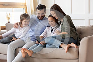 Happy family with kids use cellphone at home