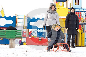 Happy family in a kids winter playground