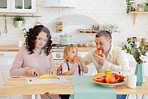 Happy family kitchen, table with fresh fruits