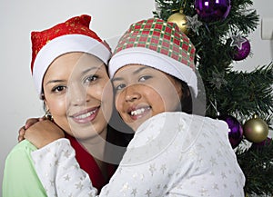 Happy family laying under the christmas tree