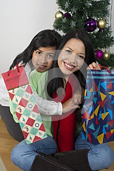 Happy family laying under the christmas tree