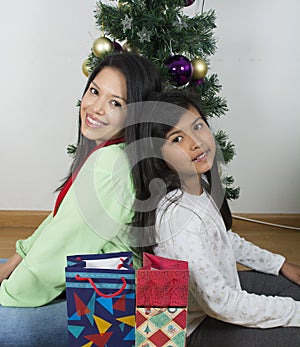 Happy family laying under the christmas tree
