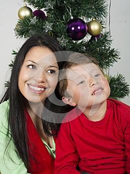 Happy family laying under the christmas tree