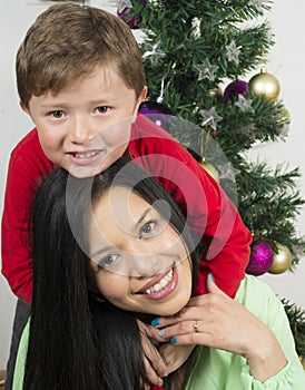 Happy family laying under the christmas tree