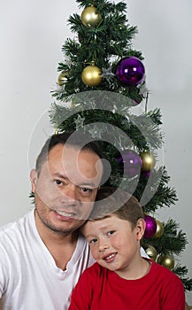 Happy family laying under the christmas tree