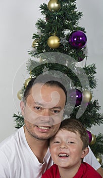 Happy family laying under the christmas tree