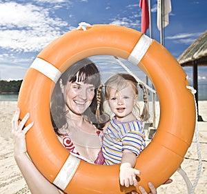 Happy family with life buoy.