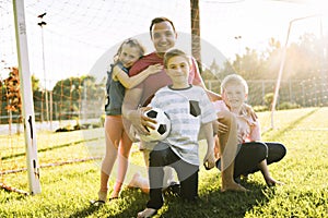 Happy family lifestyle play soccer outside