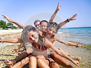 Happy Family with Little Kids Having Fun at the Beach.