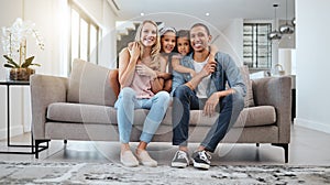 Happy family, living room and portrait of a mother, dad and girl children smile on a home sofa. Relax, hug and parent