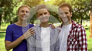 Happy family looking at camera, proud of his son, student exchange program