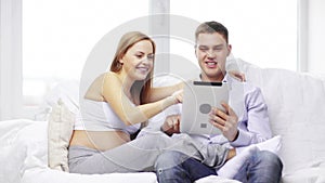 Happy family looking with tablet pc computer