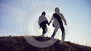 Happy family man and woman business travel teamwork walking go hand in hand silhouette of tourists on top lifestyle of