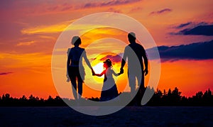 Happy family on meadow at summer