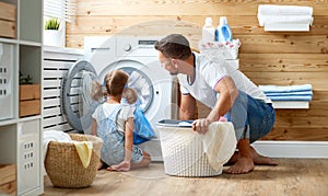 Happy family man father householder and child in laundry with photo