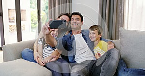 Happy family, mom or father in selfie with kids on sofa to relax on social media together for memory. Parents, vlog or